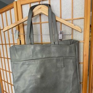 Handmade leather purse with copper handles